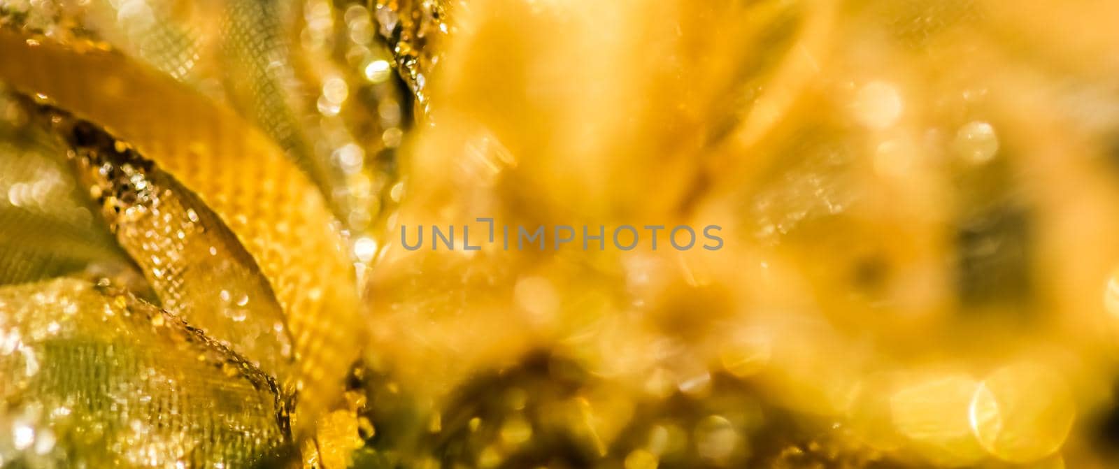 Golden abstract blur defocused background. Concept for New Years Eve, Christmas and happy holidays.