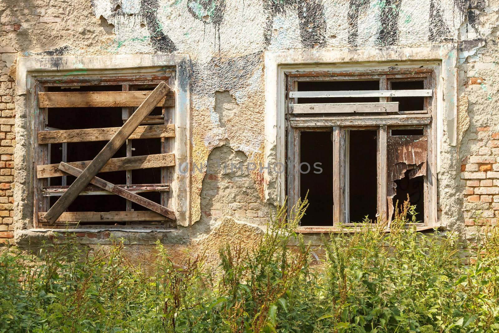two windows of old abandoned house by raddnatt