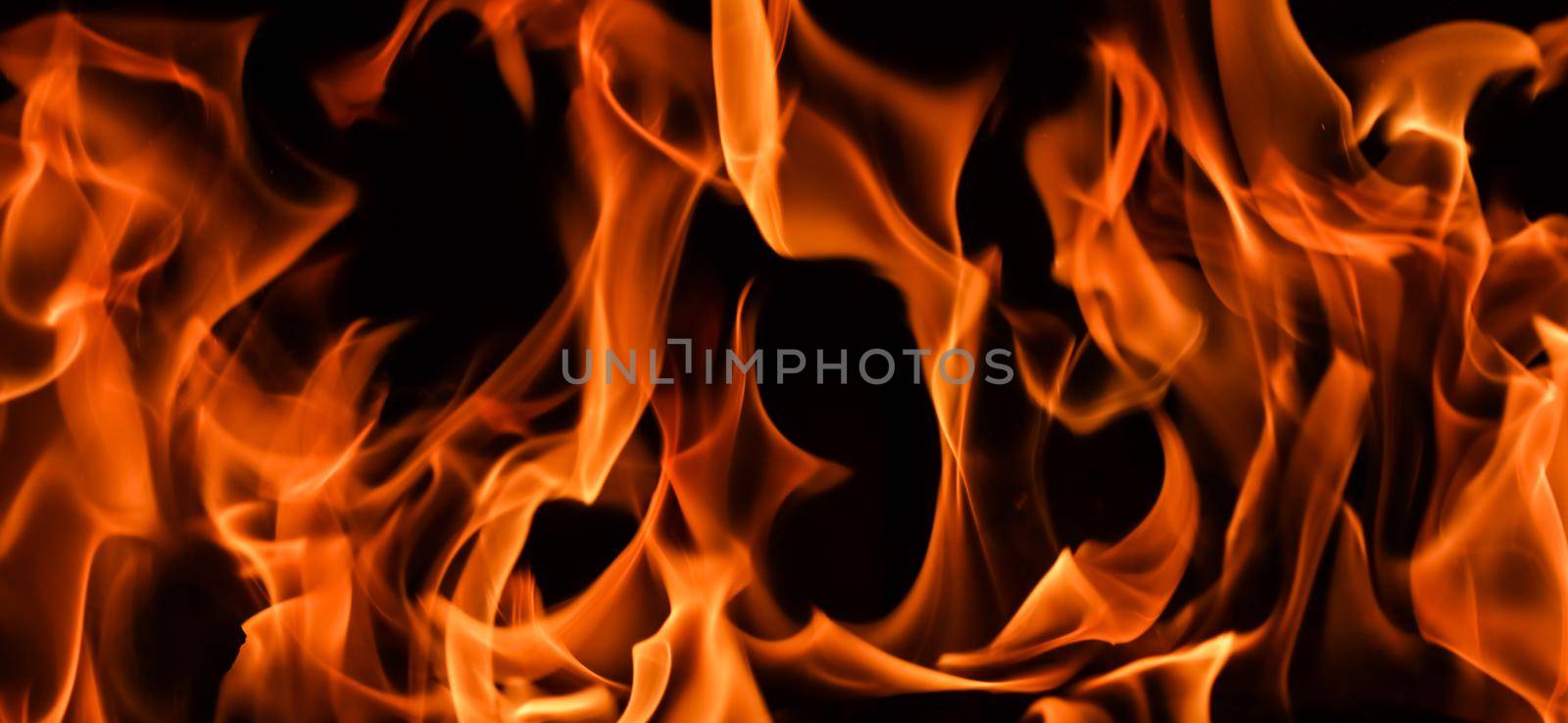 Flames of fire on a black background. The mystery of fire.