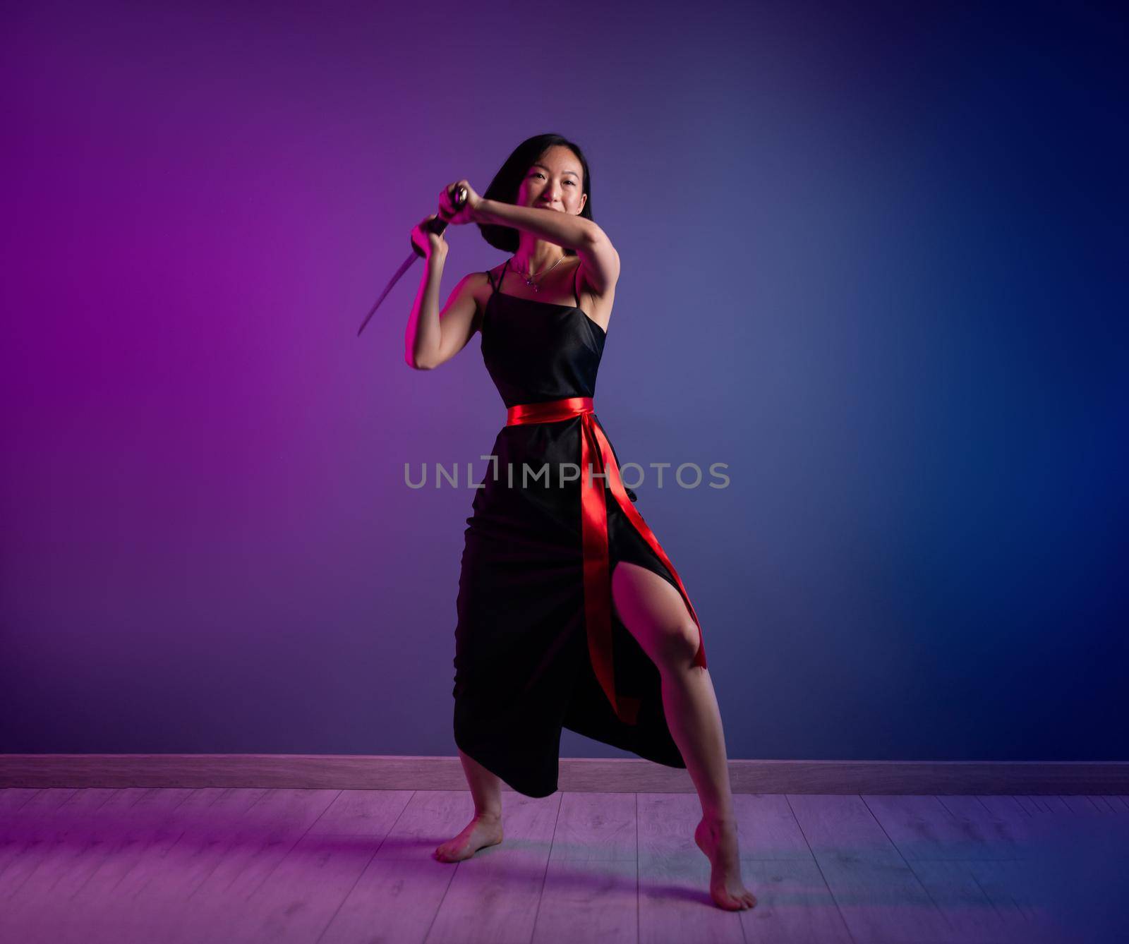 slender Asian woman in a black dress with a katana in her hand image of a samurai on a neon background by Rotozey