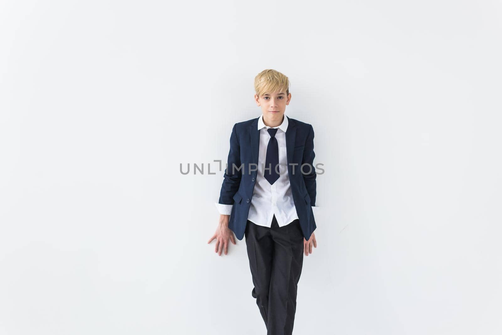 Puberty concept - Teenage boy portrait on a white background with copyspace. by Satura86
