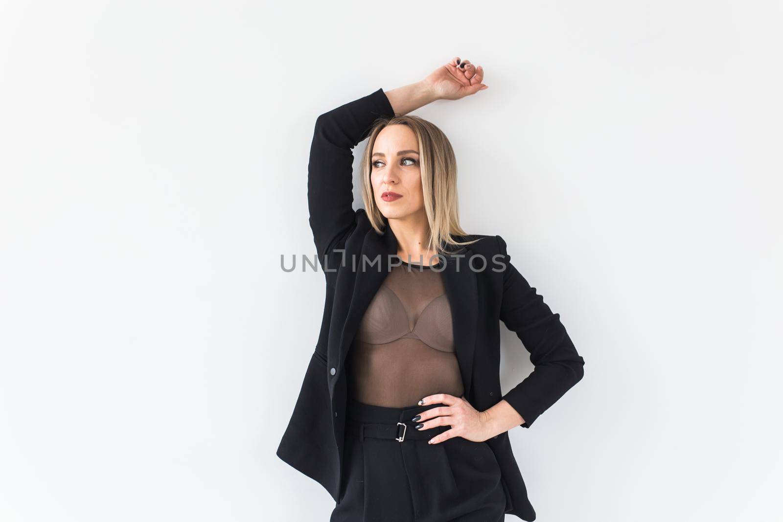 Sexy business woman posing on white background. by Satura86