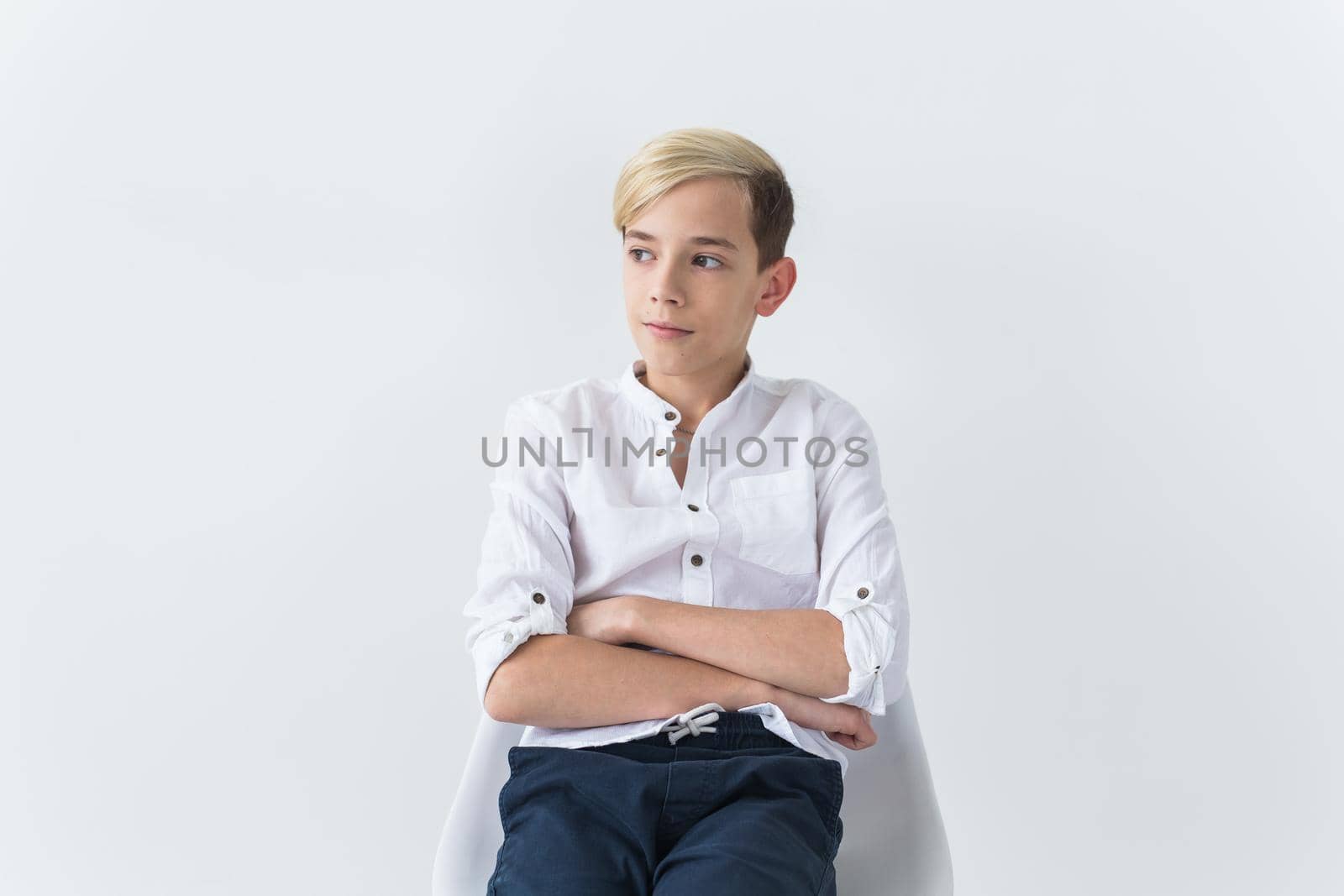 Teenage depression and puberty concept - Sad teenager portrait close up on white background. by Satura86