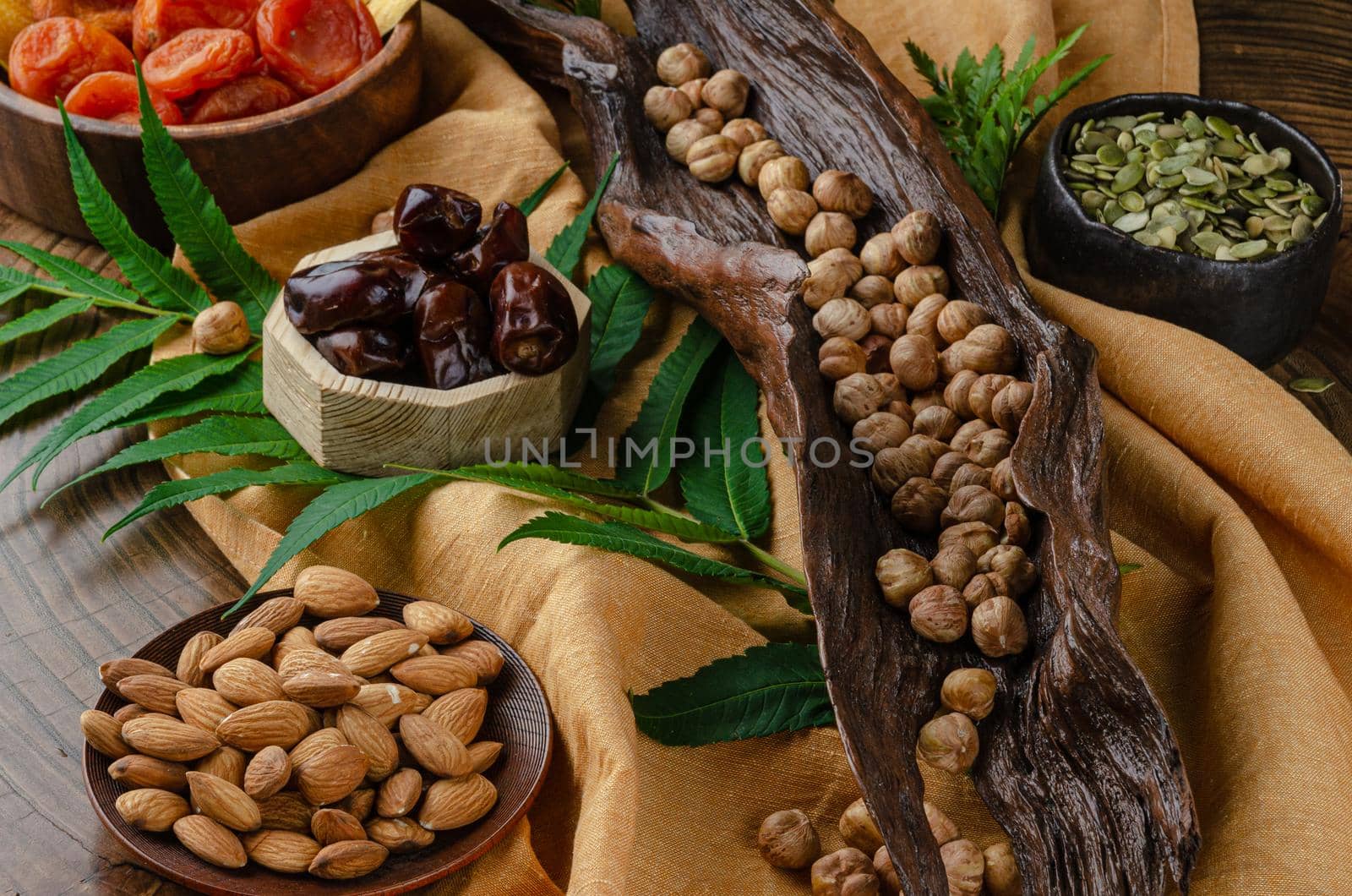 still life of nuts and dried fruits by Rotozey