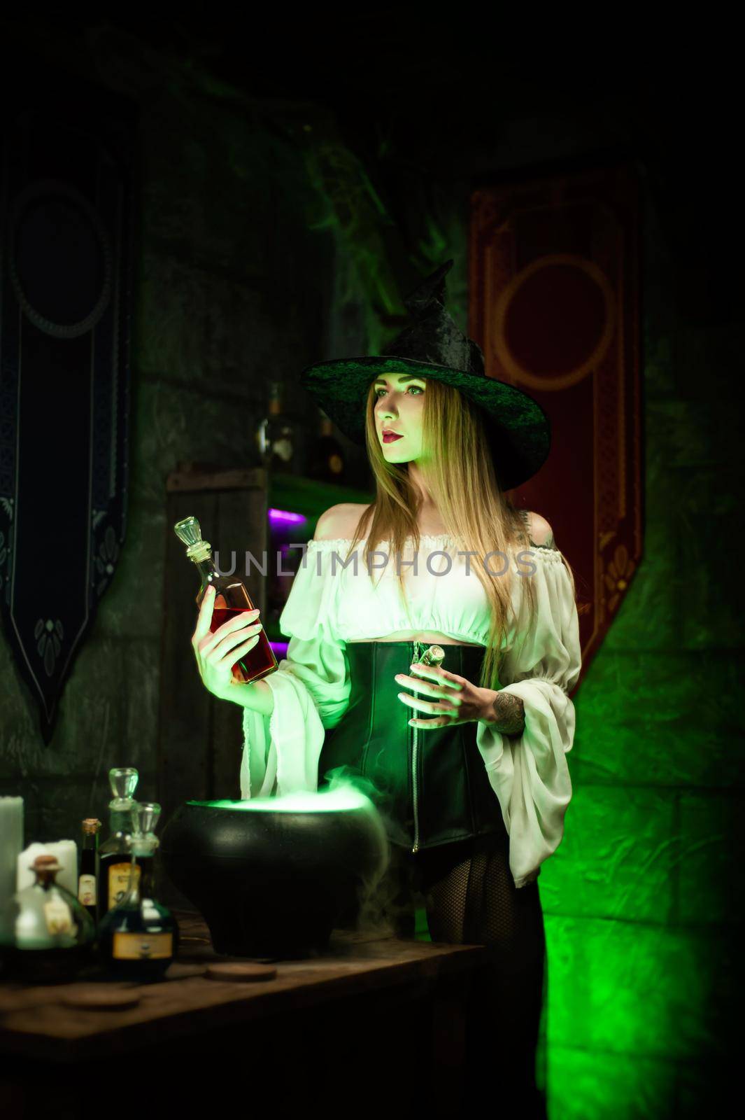 women in a hat in the witch's room on Halloween by Rotozey