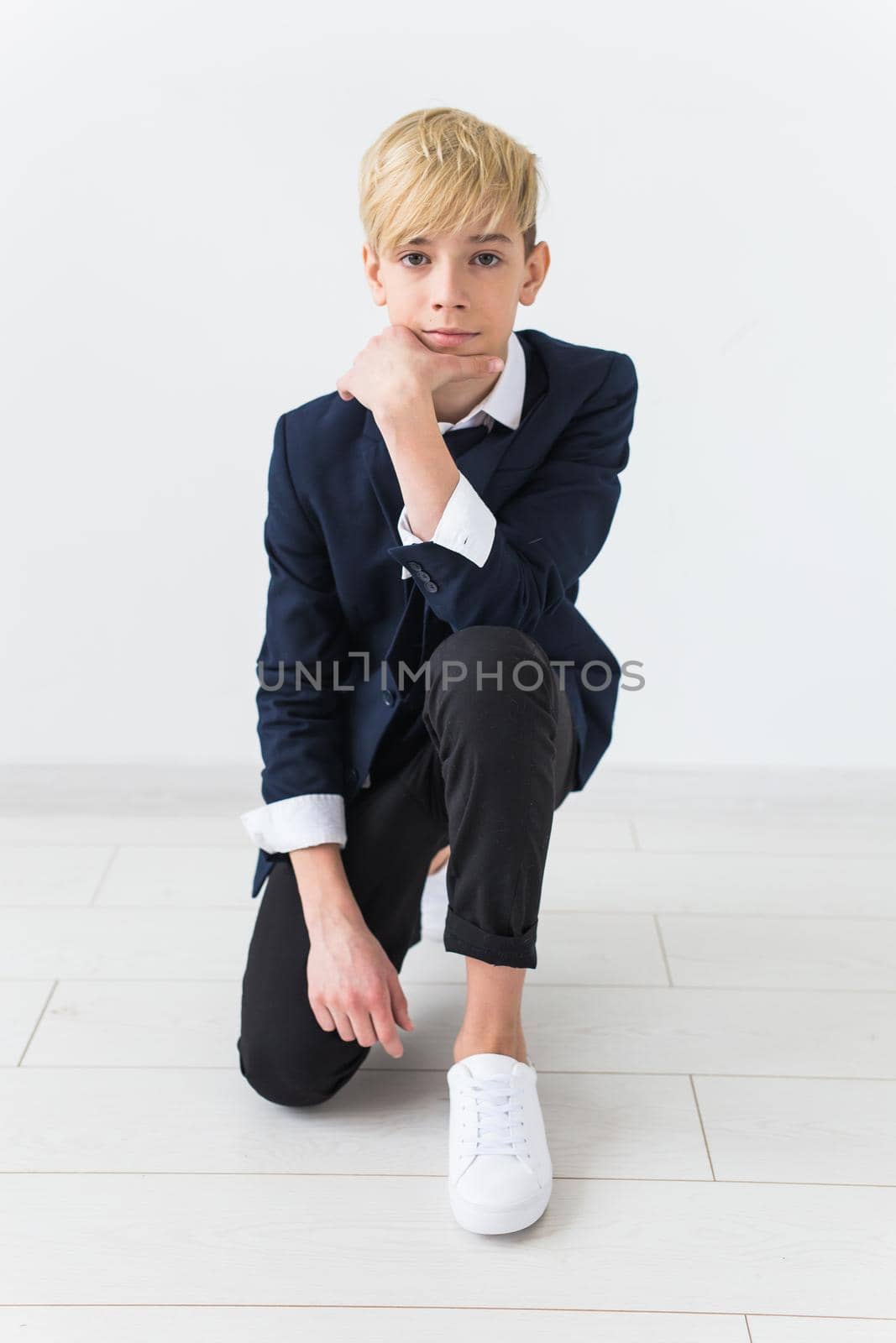 Puberty concept - Teenage boy portrait on a white background. by Satura86