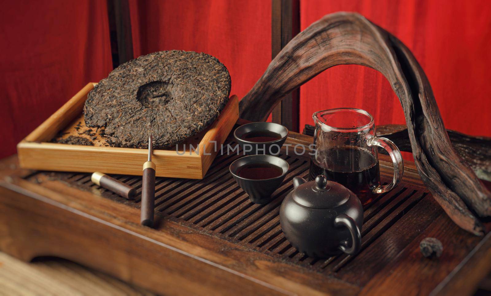 tea table with instruments teapots cups pancake and tea Shen Puer by Rotozey