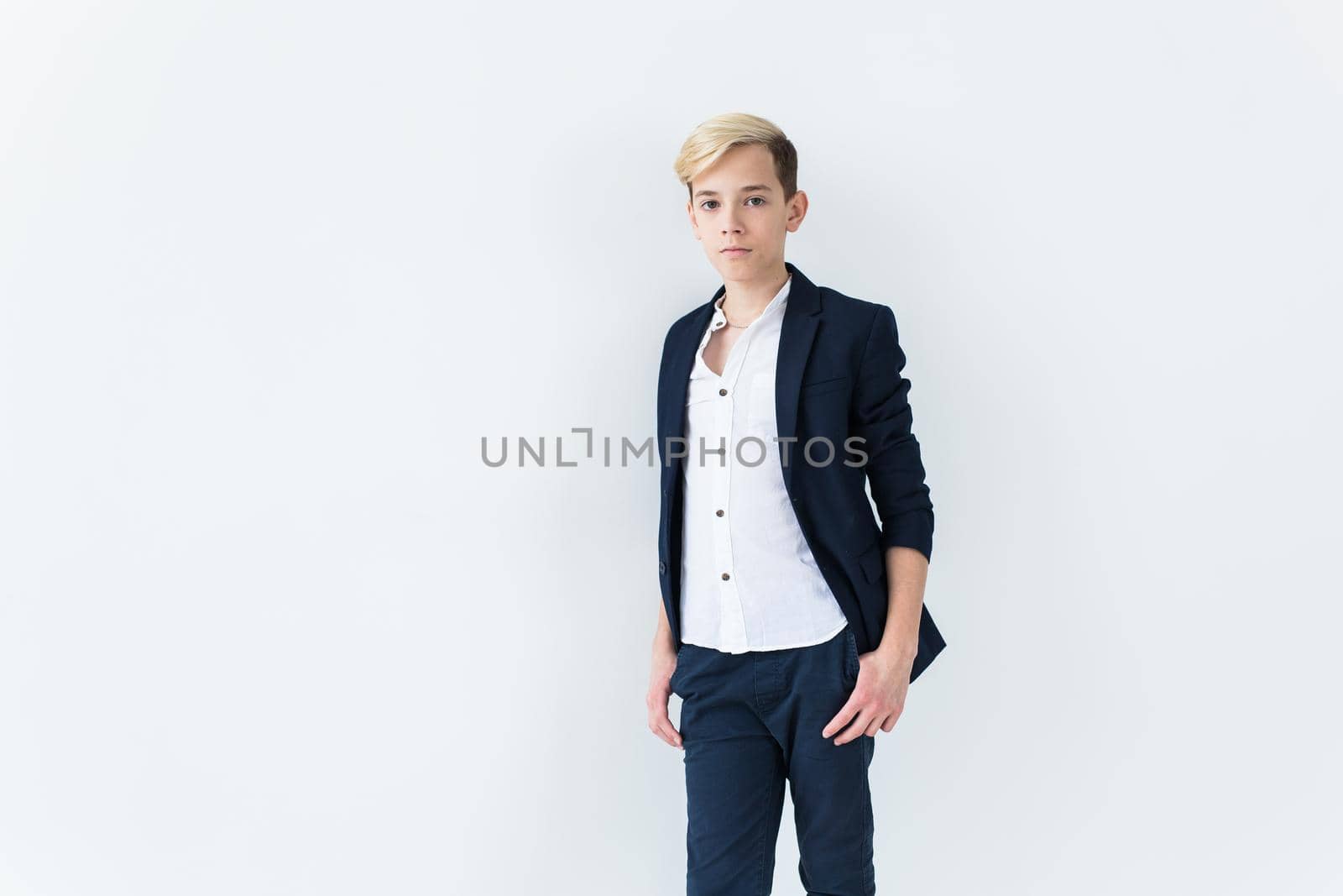 Puberty concept - Teenage boy portrait on a white background with copyspace. by Satura86