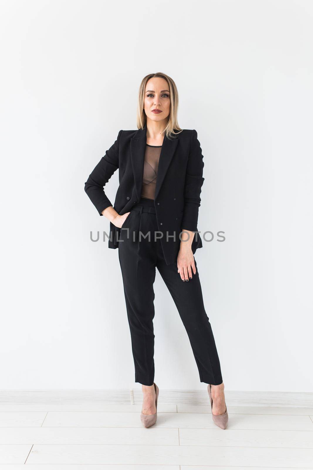 Sexy business woman posing on white background. by Satura86