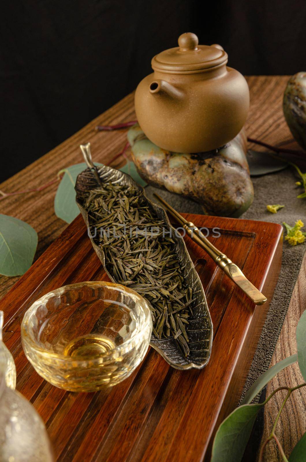 the tea table with instruments teapots cups pancake and tea Shen Puer