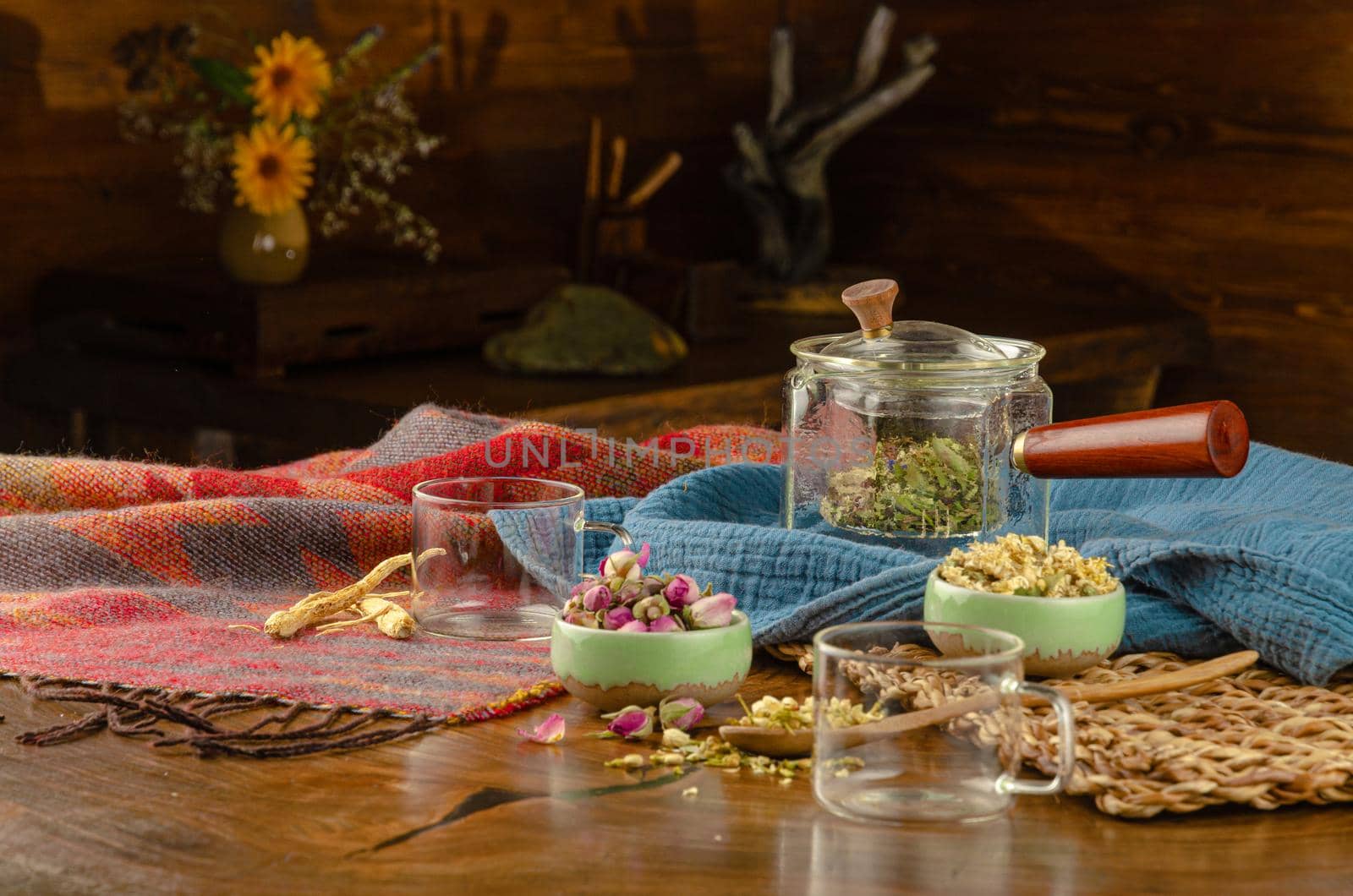 table with herbal tea and rose petals