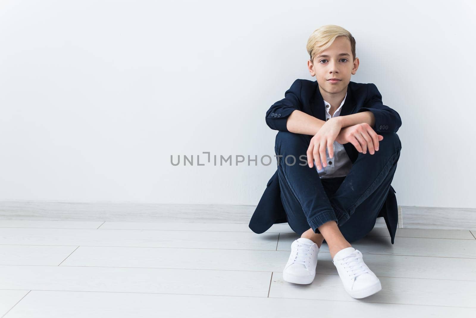 Teenage depression and puberty concept - Sad teenager portrait close up on white background. by Satura86