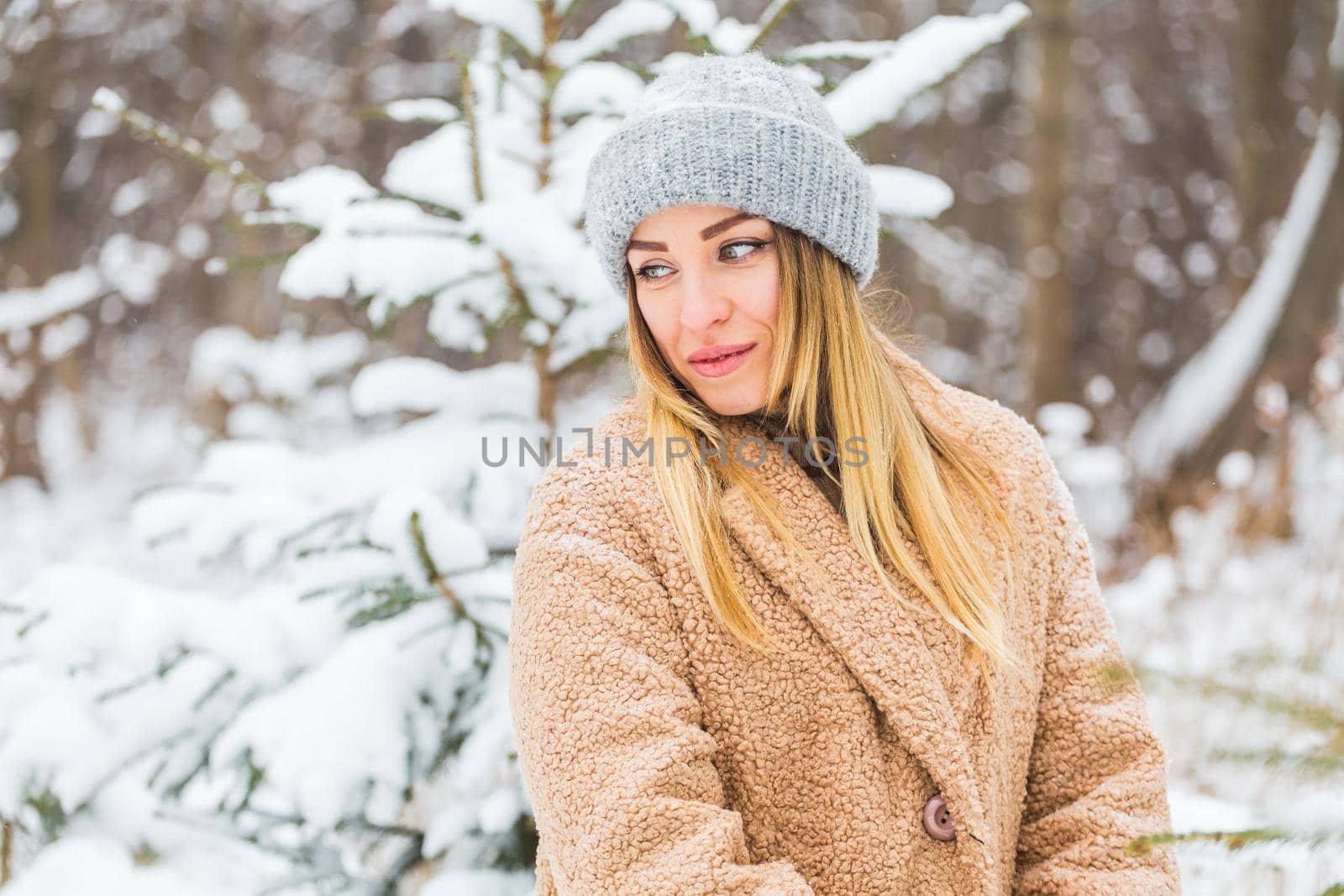 Attractive young woman in winter time outdoor. Snow, holidays and season concept. by Satura86