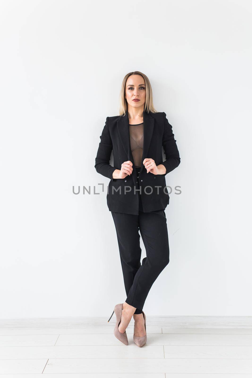 Sexy business woman posing on white background. by Satura86