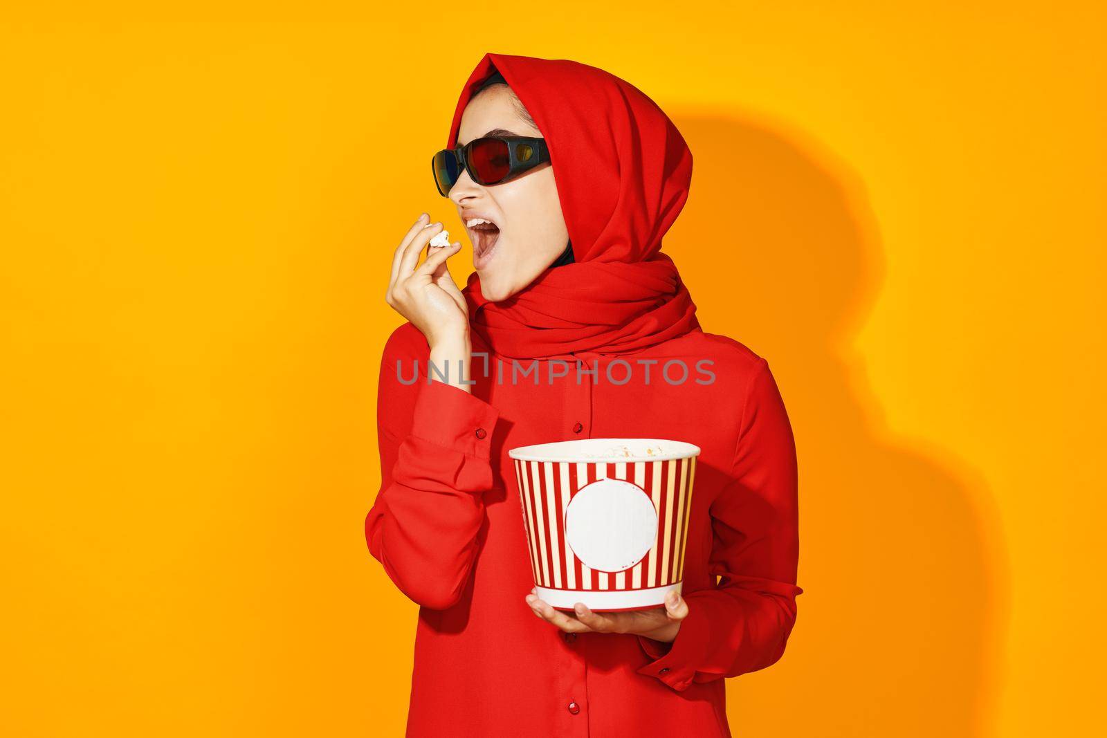 woman in red hijab virtual reality movie fashion fun movie isolated background. High quality photo
