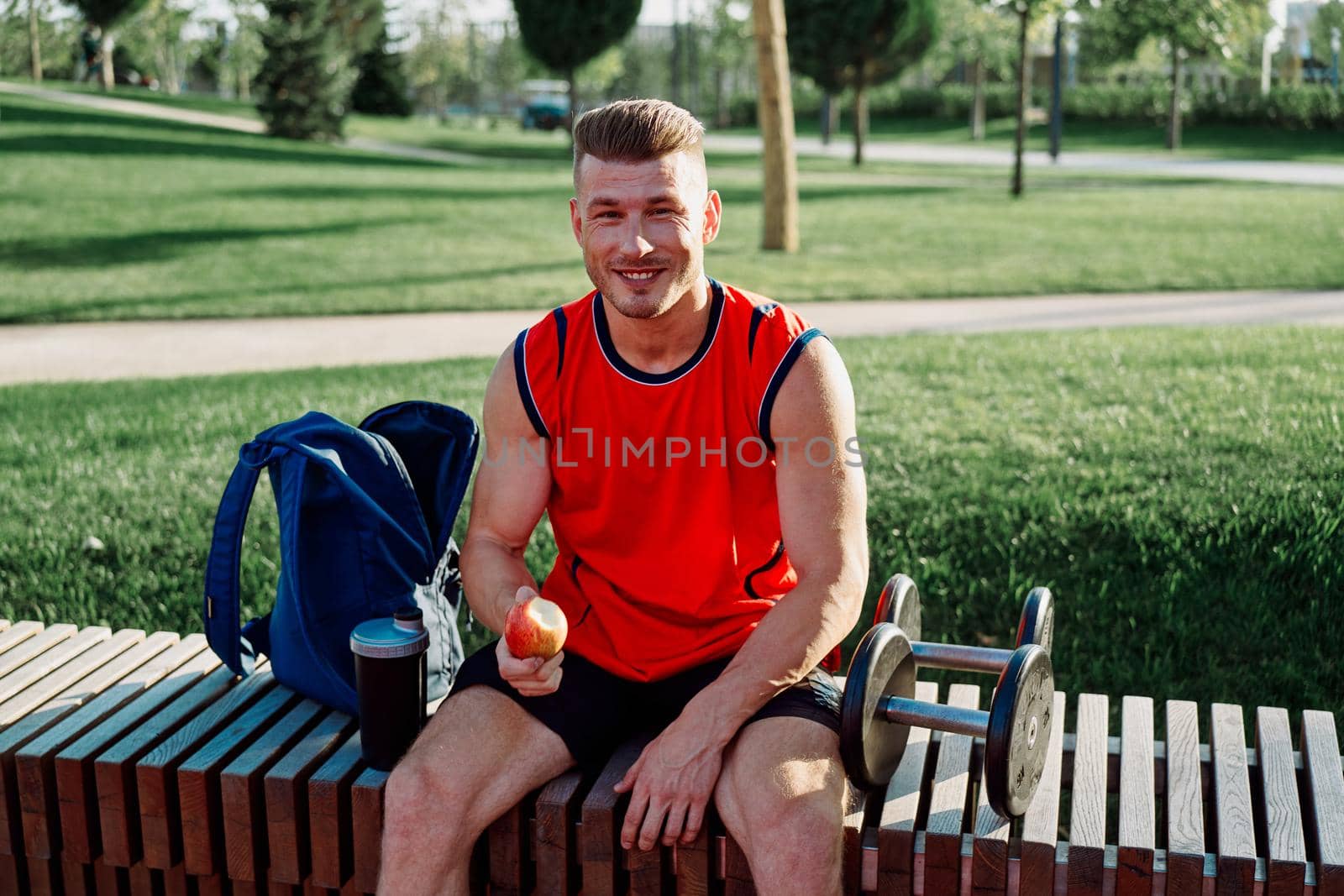 sporty man sitting on bench fitness workout lifestyle by Vichizh