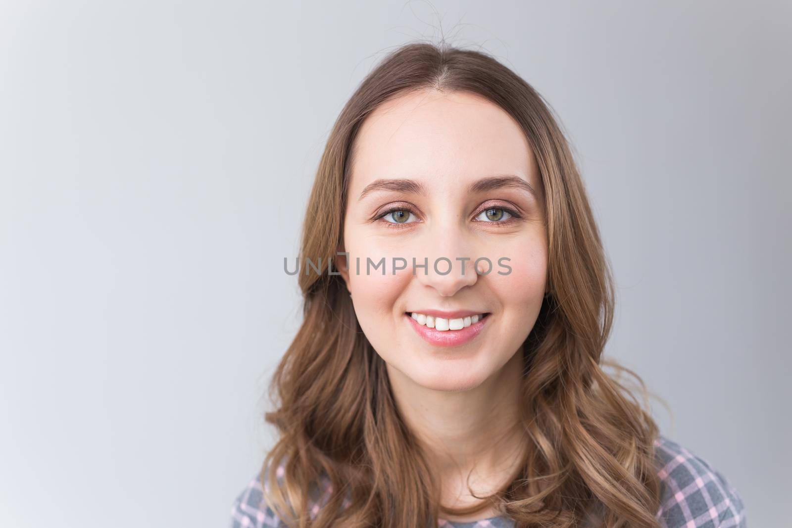 face of a beautiful young girl with a clean fresh face close up