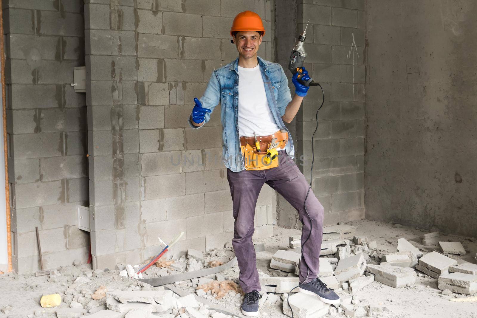 Handyman with a tool belt. House renovation service.