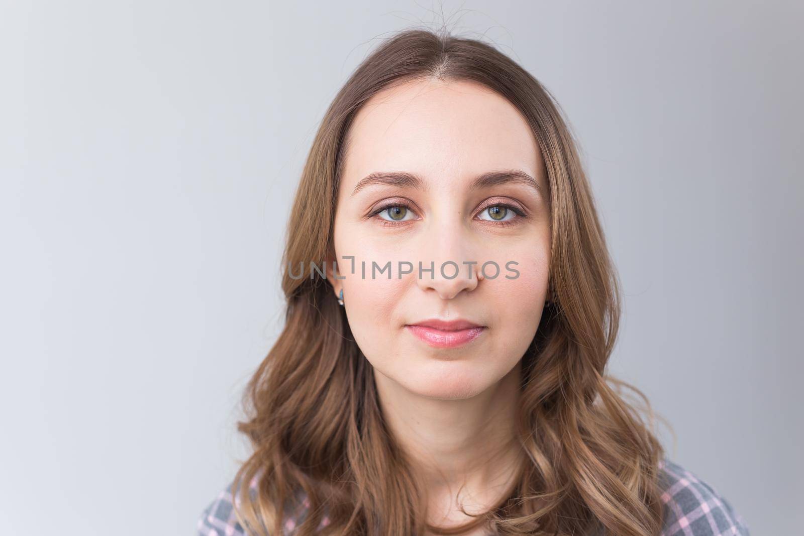 face of a beautiful young girl with a clean fresh face close up