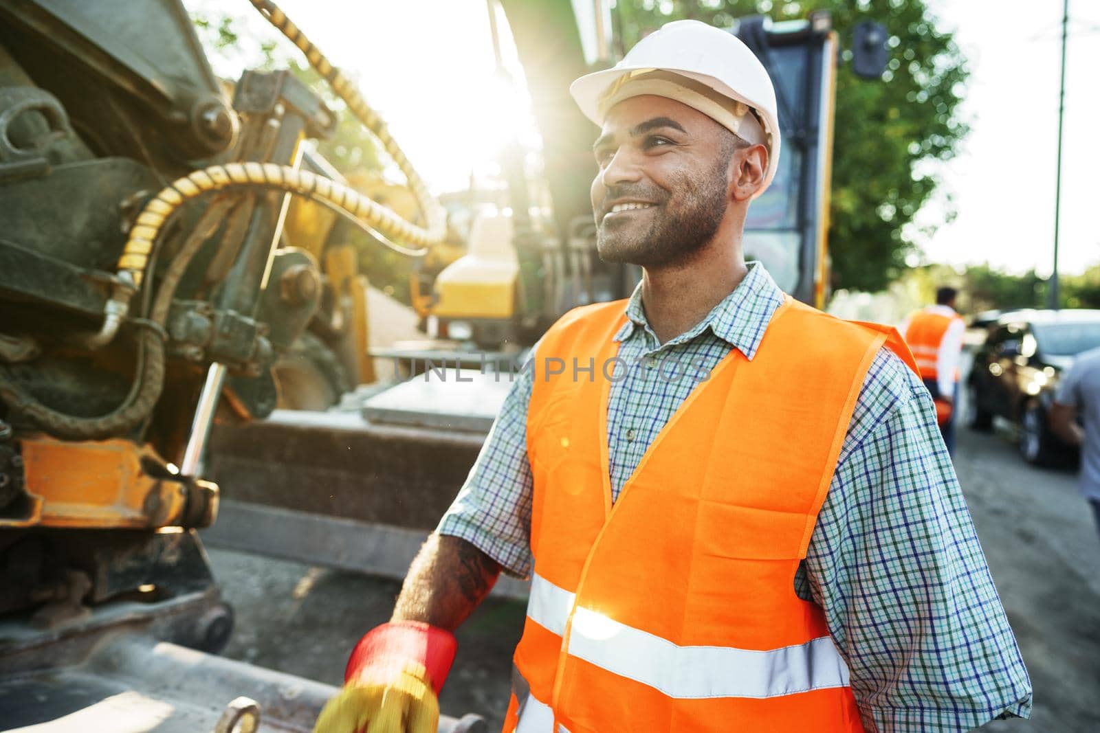 Portrait of young construction engineer wearing hardhat, close up