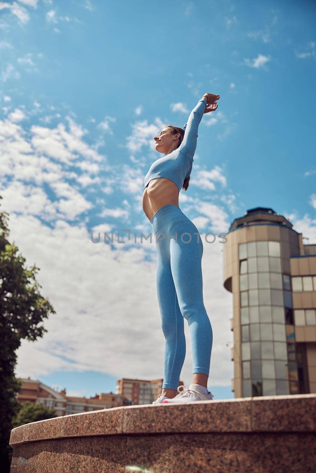 Beautiful fit young woman jogger is running outdoors by Yaroslav_astakhov