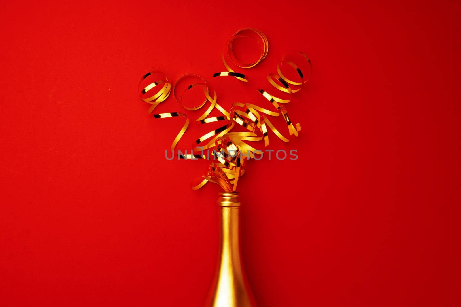 Champagne bottle with streamers flat lay top view, Christmas background