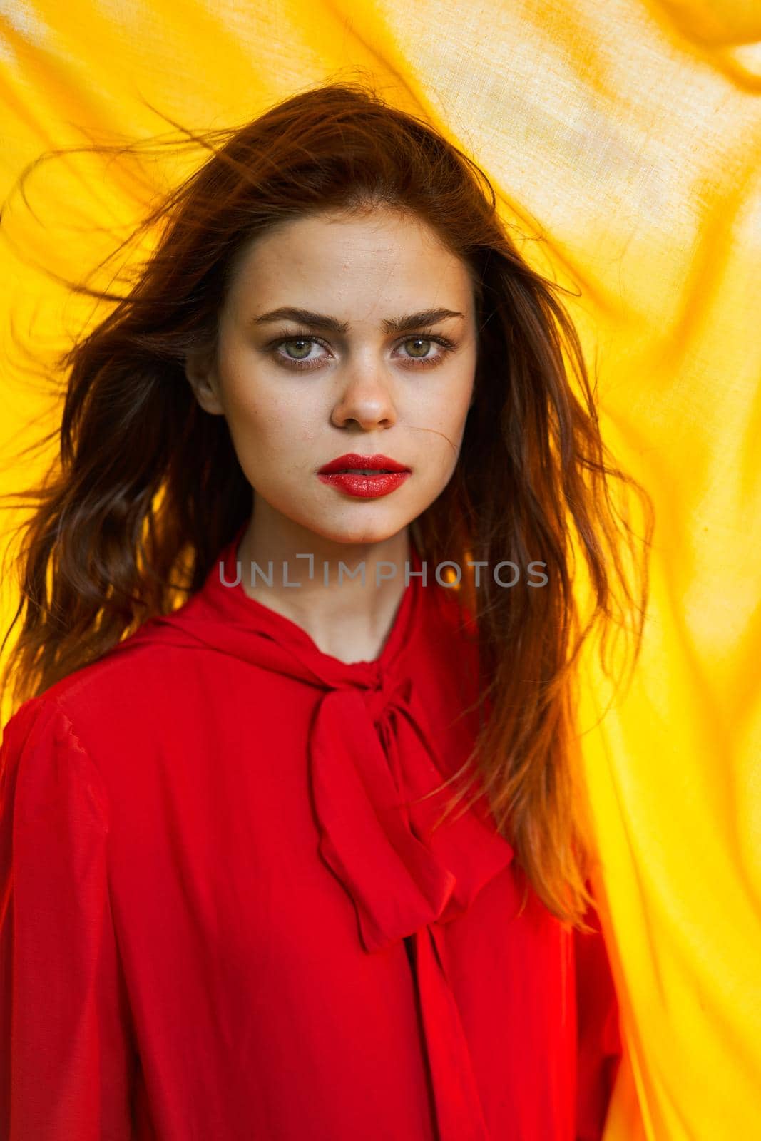 cheerful woman in red dress makeup yellow cloth posing by Vichizh