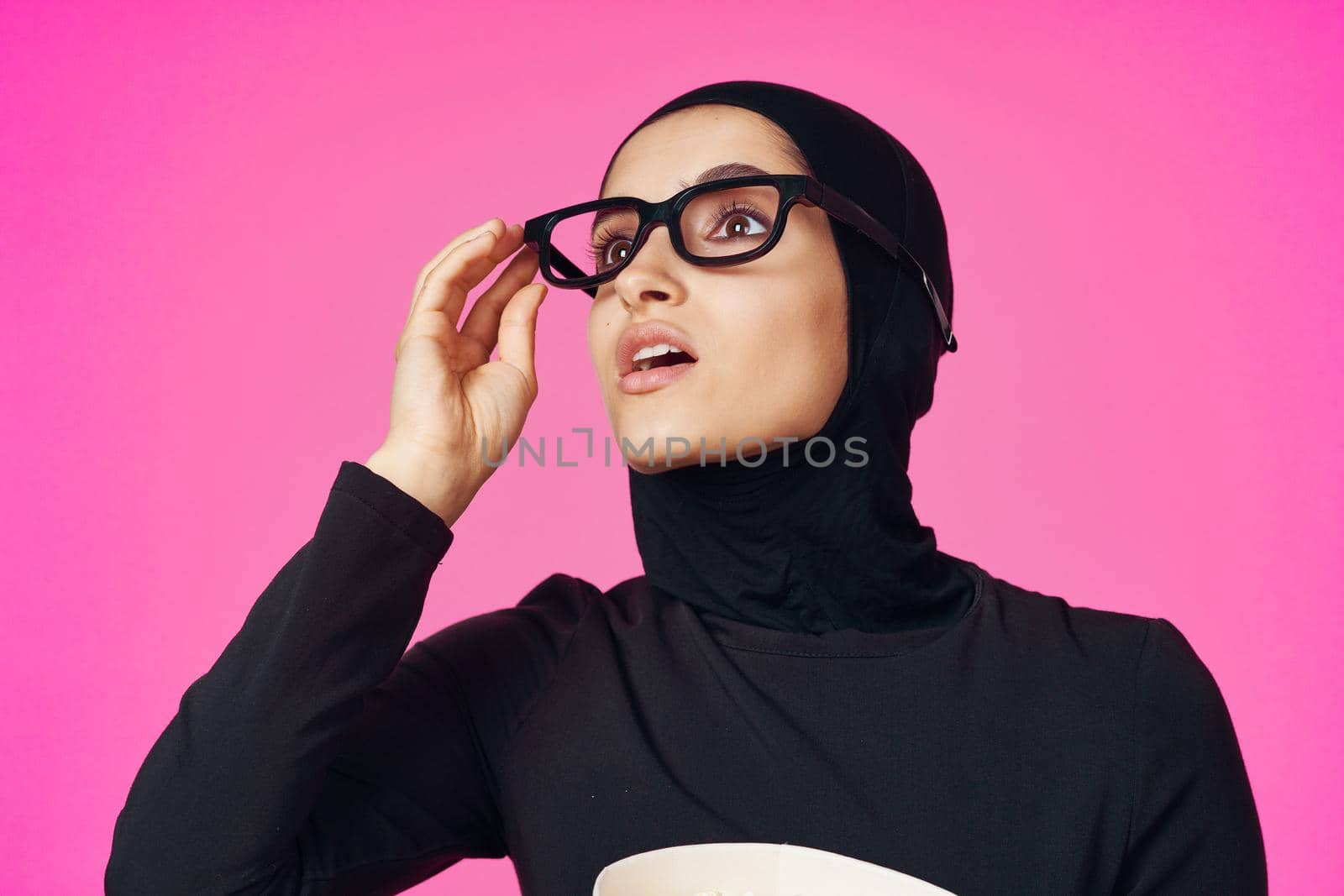 pretty woman attractive look popcorn glasses movie watching purple background. High quality photo