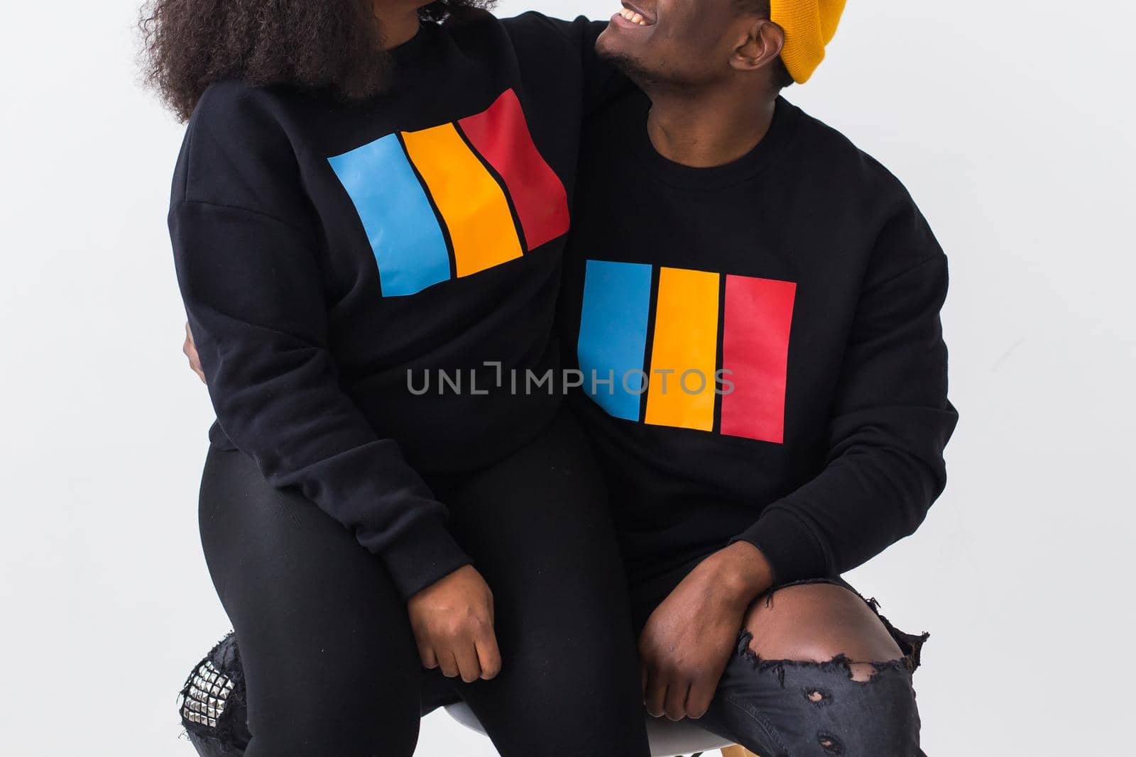 Close-up of happy African American woman and man have relationships, toothy smile, happy to meet with friends, dressed casually on white background. Emotions and friendship concept. by Satura86