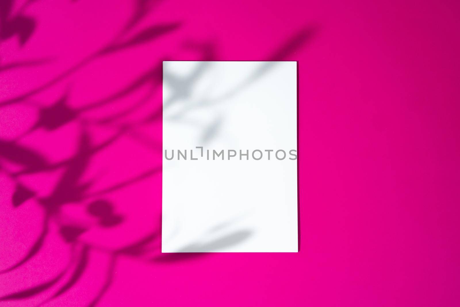 Advertising mock-up. White blank businesscards on bright pink background. copy space