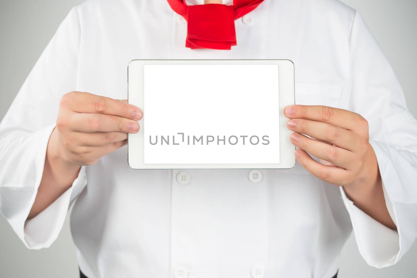 cooking, technology and home concept - closeup of man pointing finger to tablet pc computer