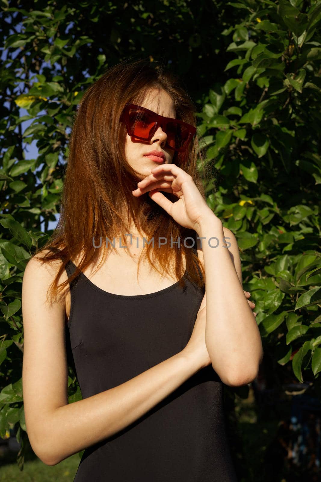 pretty woman wearing sunglasses summer nature posing by Vichizh