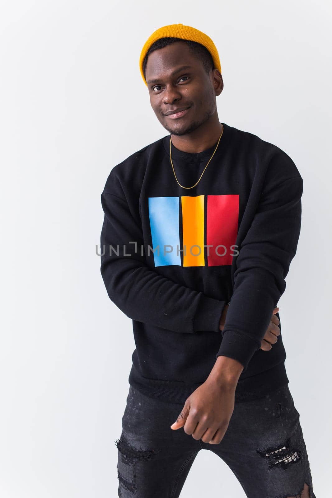 Young handsome african american man with an afro hairstyle. Portrait on white background. Guy looking at camera