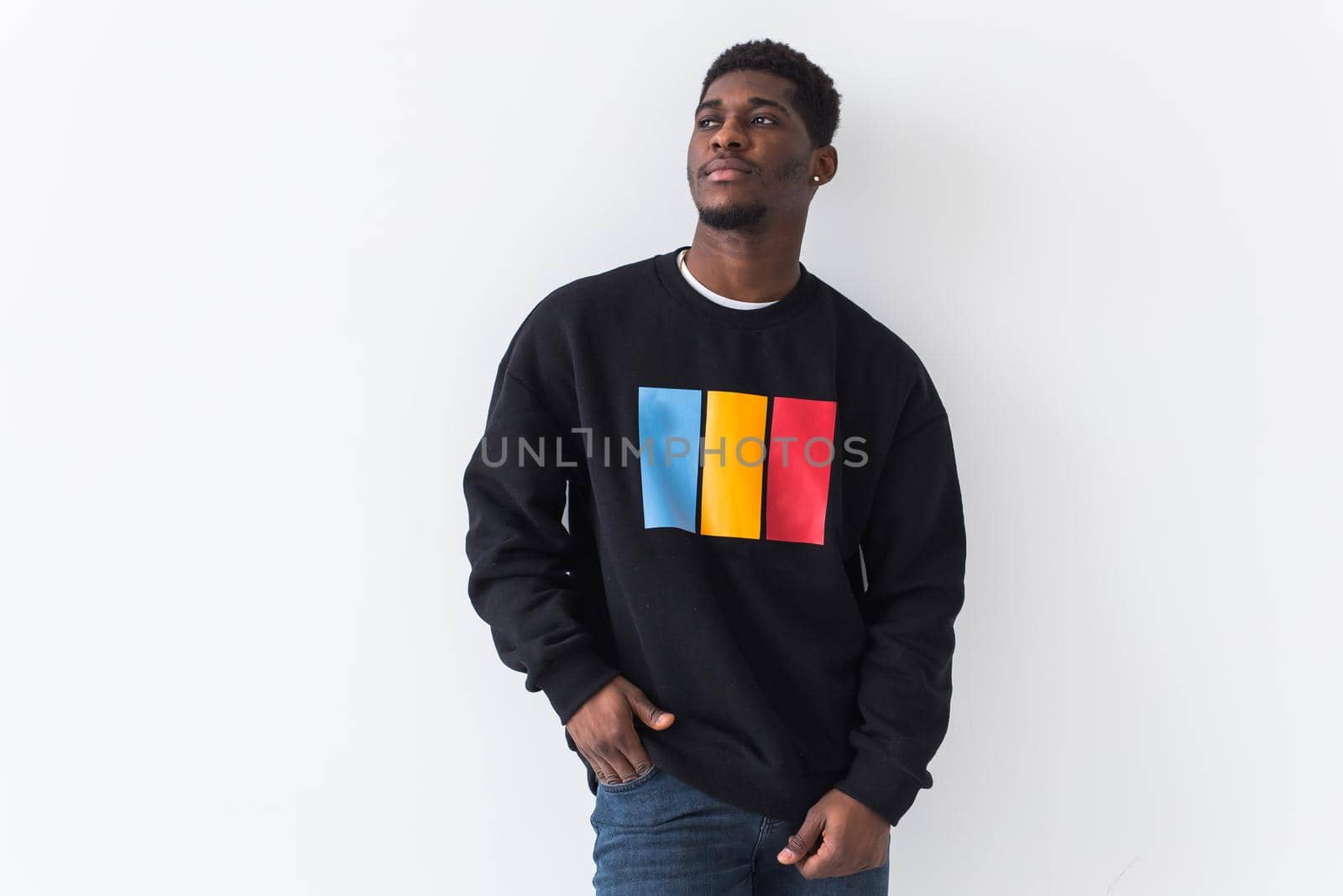 Young handsome african american man with an afro hairstyle. Portrait on white background. Guy looking at camera