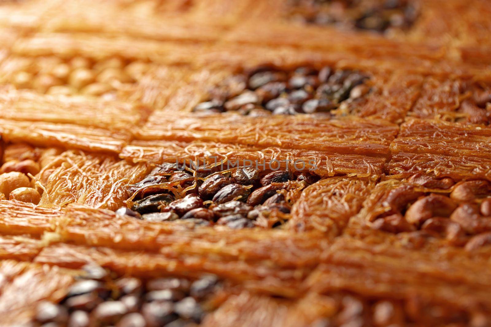 Close up photo of Turkish Baklava dessert with honey and nuts