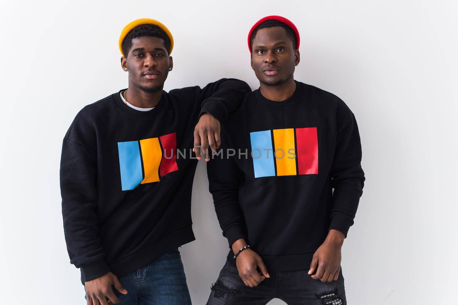 Street fashion and friendship concept - Two happy african american young men in black stylish sweatshirts. by Satura86