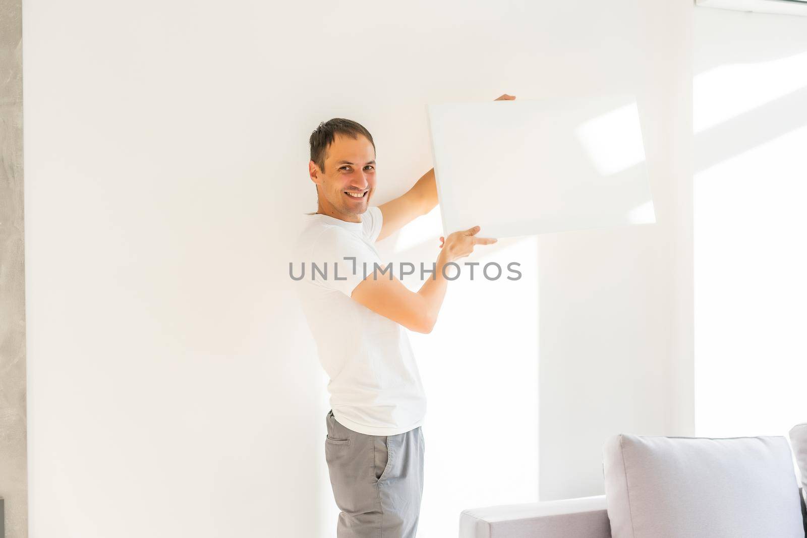 man with canvas mockup. Photo Mockup. The man hold canvas. For canvas design.