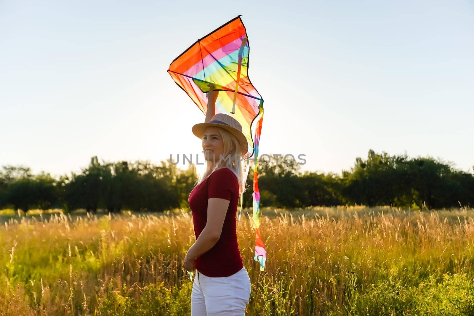 woman with a kite in the field