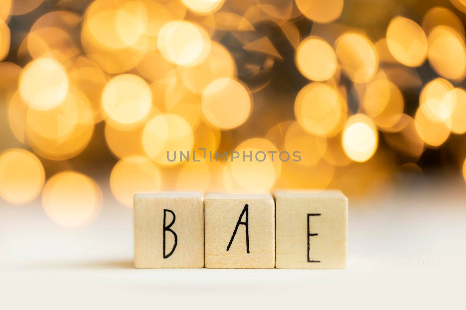 Bea acronym for before anyone else, best friend or loved one, social media term with gold bokeh background copy space
