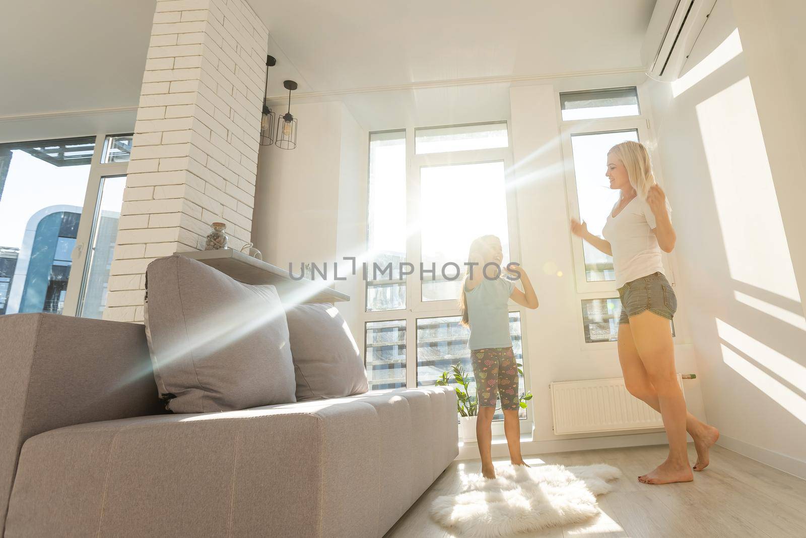 Happy loving family. Mother and her daughter child girl playing and dancing together