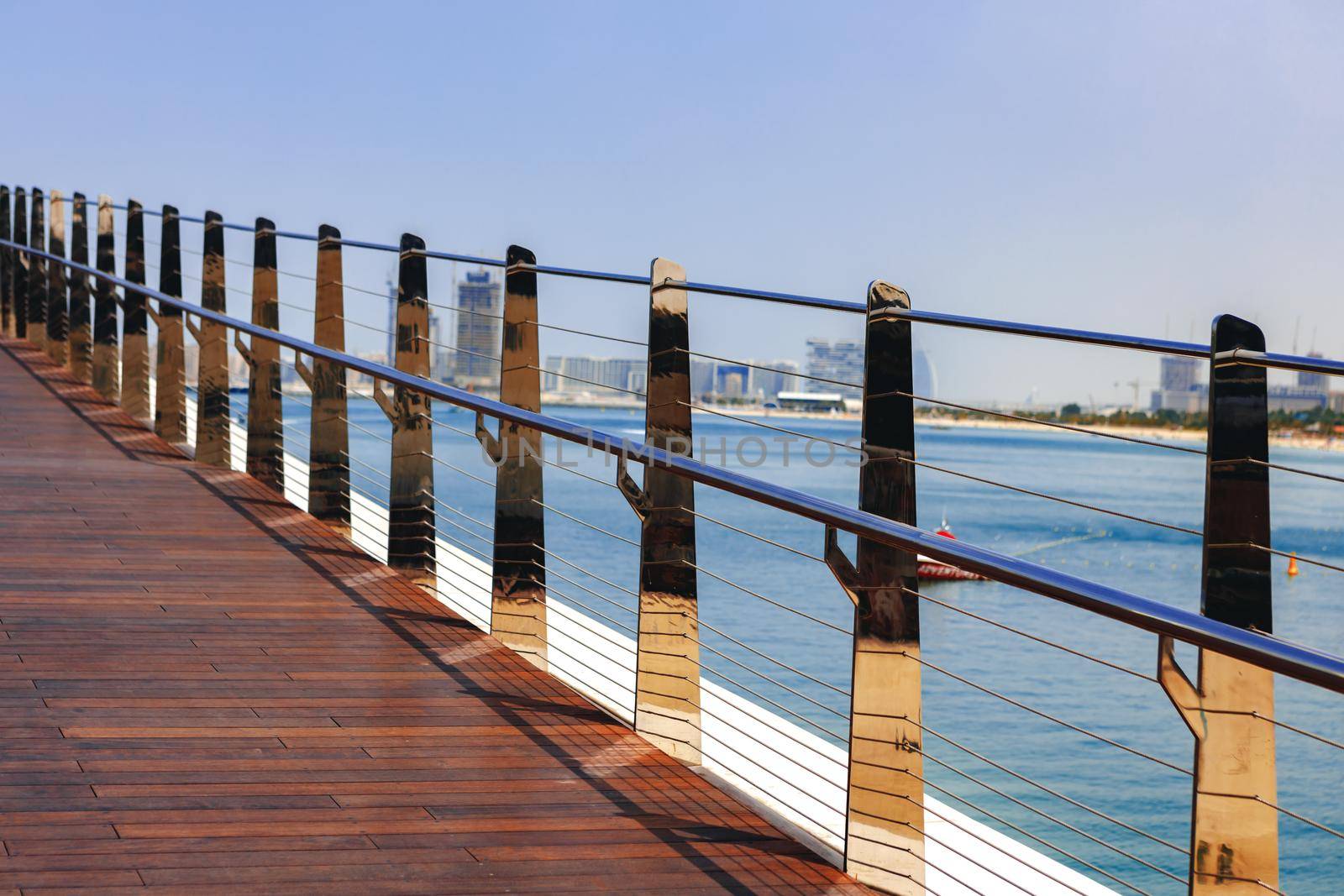 Pedestrian hanging bridge over sea in Dubai Marina, UAE
