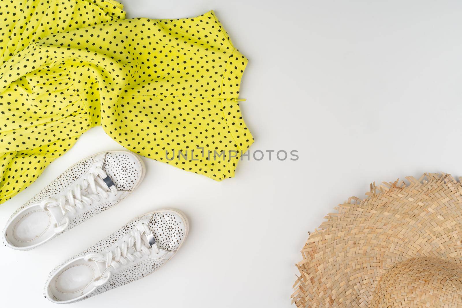 Flat lay of woman summer outfit on white background. Close up.