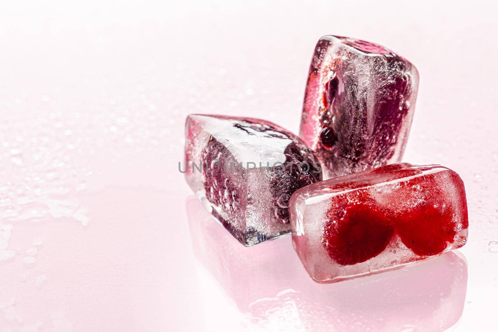 Close up of ice cubes with berries. Close up.