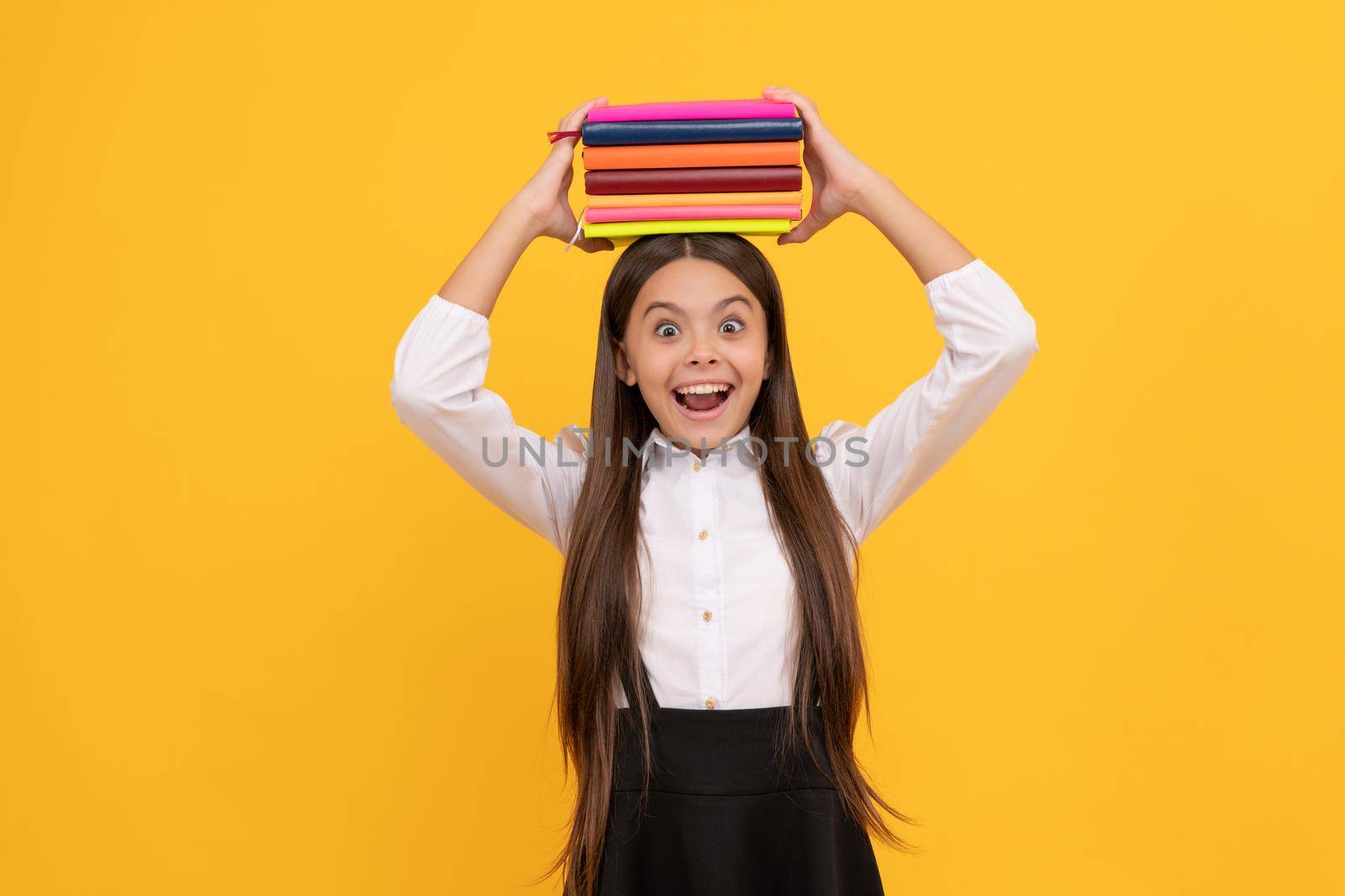 back to school. education. book store. childrens literature. overwhelmed intellectual child. educational literature. bookish kid in grammar school. surprised teen girl hold books heap. too much work.