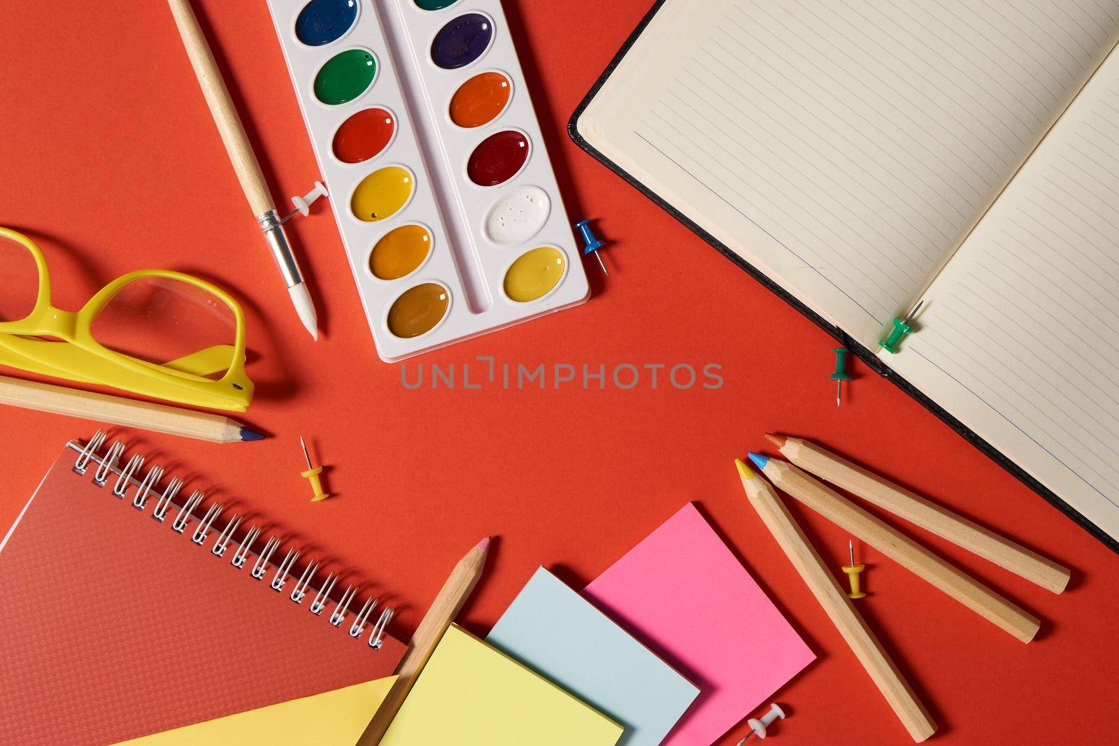 paint pencils drawing supplies design learning red background. High quality photo