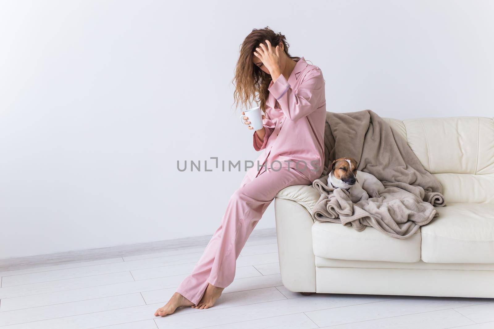 Glamorous girl with happy smile in good morning. Positive female model drinking hot tea.