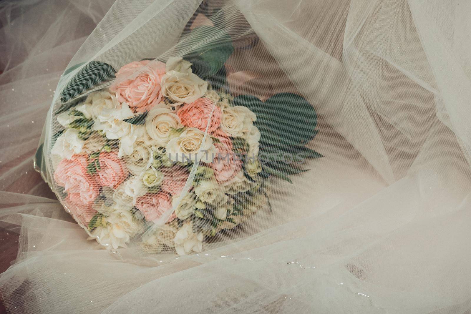 The best gift for the bride, a wedding bouquet of flowers, a bouquet of the bride and bridesmaids at the wedding. by Niko_Cingaryuk