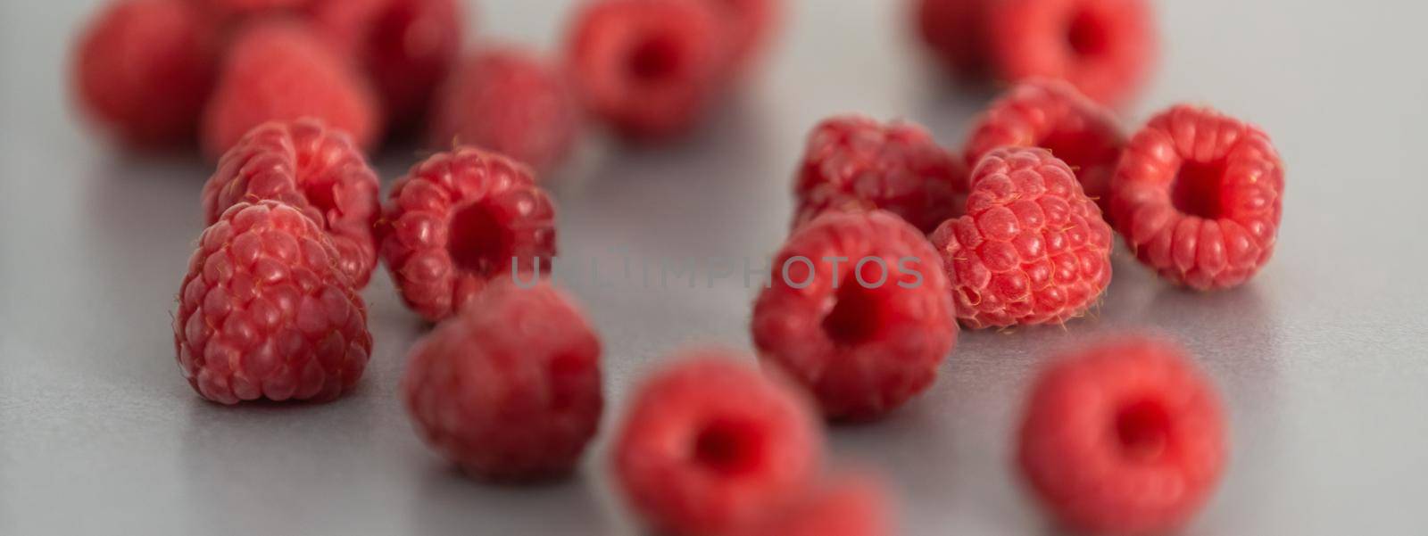 red Raspberry fruit on gray background chocolate by Andelov13