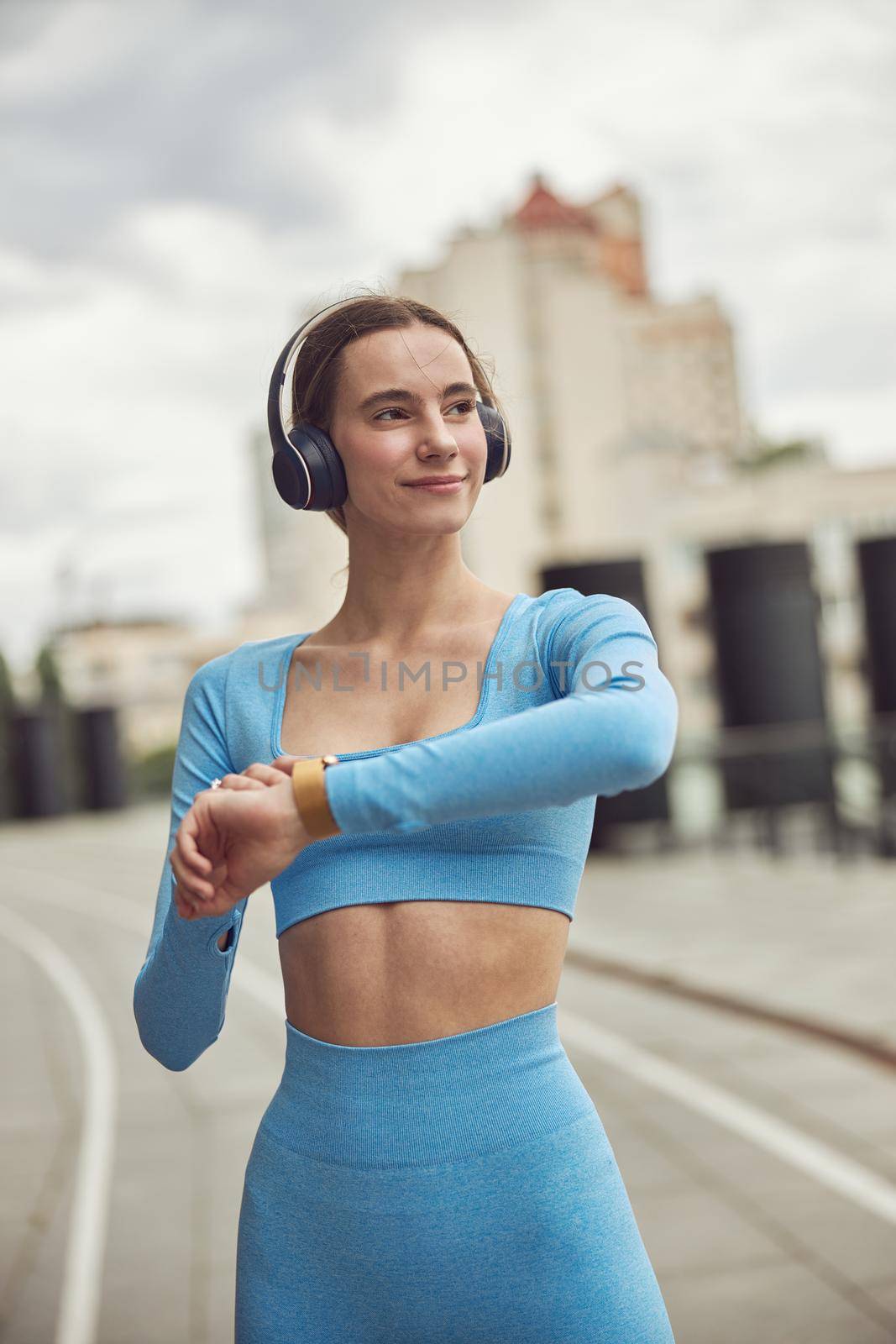 happy beautiful caucasian woman at workout in urban city