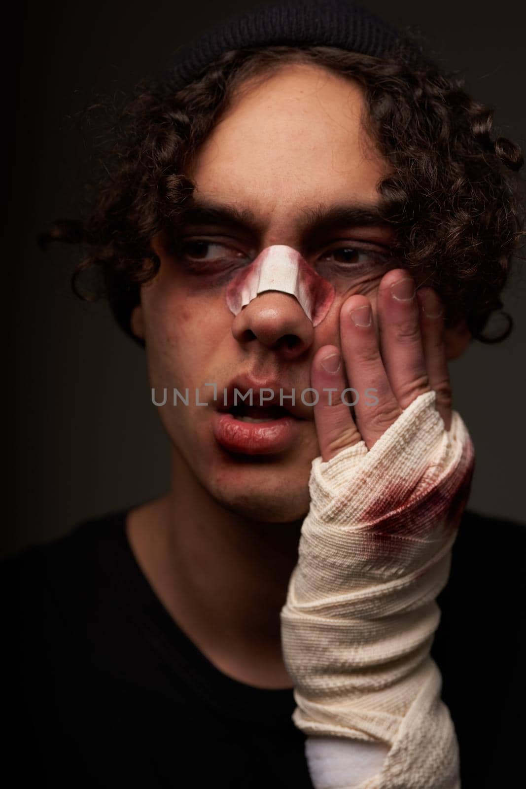 a man with bruises under his eyes boxer workout dark background. High quality photo